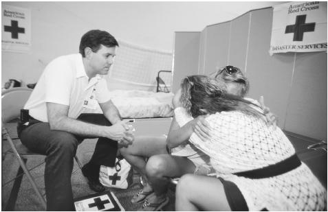 Immediate crisis intervention after a tragedy or natural disaster may help victims express their feelings and fears and may help them to avoid developing acute stress disorder and post-traumatic stress disorder. Here, victims of a 1993 flood in Missouri receive counseling.  (Najlah Feanny-Hicks. Corbis/SABA. Photo reproduced by permission.)
